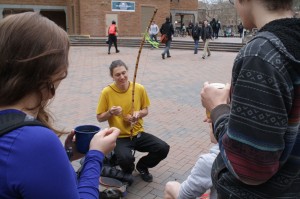 A fellow from the capoeira club plays the berimbau.