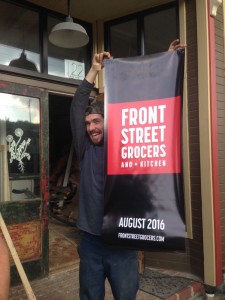 Corey holds a new banner.